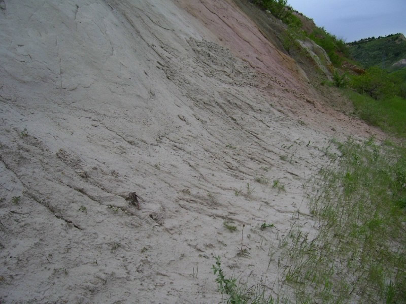 Sand washing off Laramie Formation sandstone as it erodes Laramie Formation sandstone